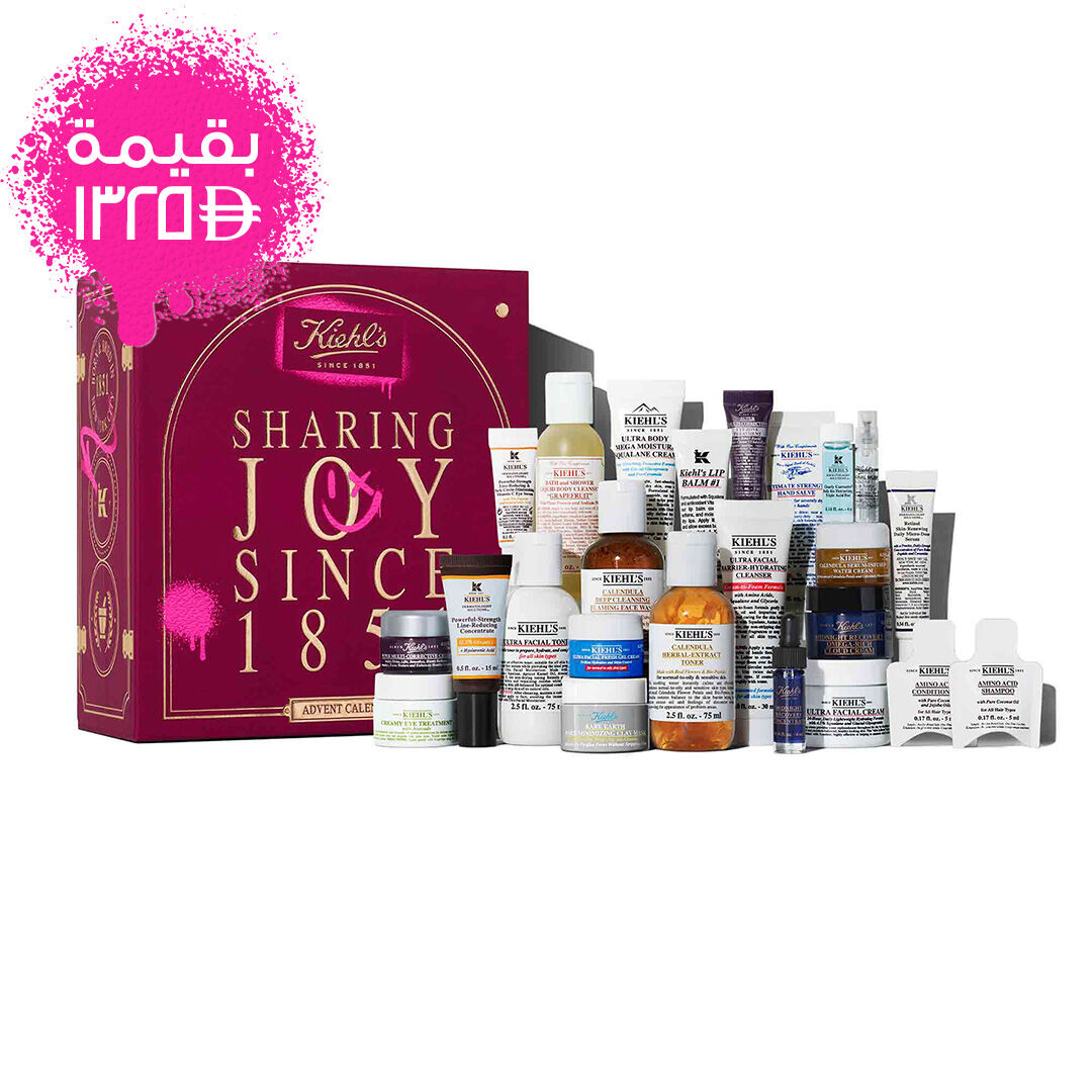 The Kiehl’s Advent Calendar displayed with the box on the left and 24 mini skincare and body care products arranged in front. The products include cleansers, toners, serums, masks, and moisturizers.​
