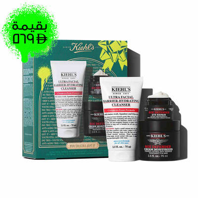 A graphic set against a dark green textured background with bright green accents features three Kiehl’s products and a gift box. On the left is a white tube of "KIEHL’S ULTRA FACIAL BARRIER-HYDRATING CLEANSER" labeled "TRAVEL SIZE." In the center are a black jar of "KIEHL’S AGE DEFENDER CREAM MOISTURIZER" and a black jar of "KIEHL’S AGE DEFENDER EYE REPAIR" with visible cream, both labeled "FULL SIZE." To the right is a boxed Kiehl’s gift set displaying the same three products, decorated with bright green graphic shapes and a bow design."